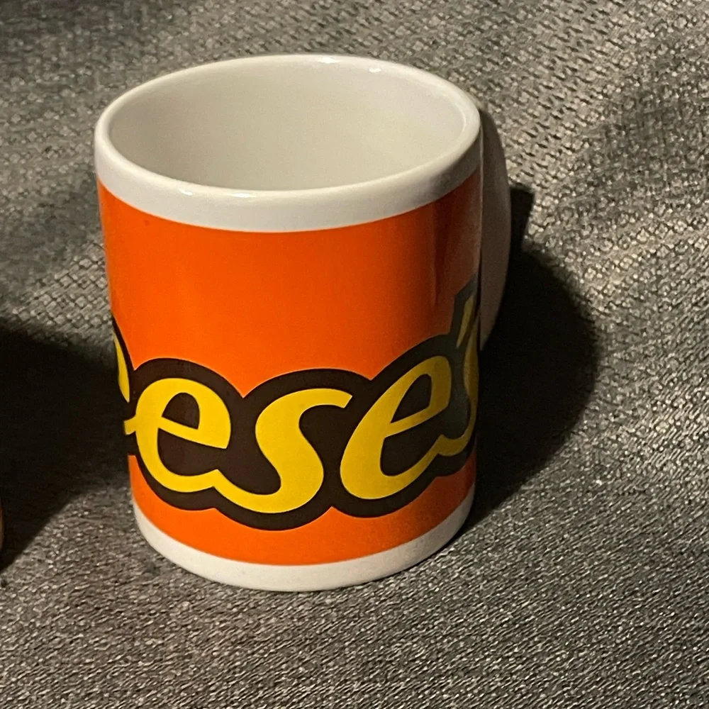 Pair of Reese’s candy mugs.
